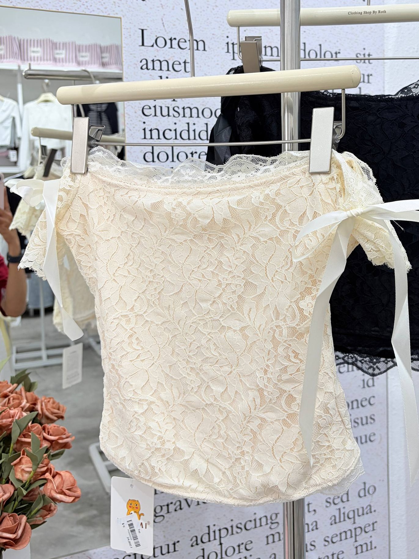 Off-the-shoulder lace top with ribbon ties