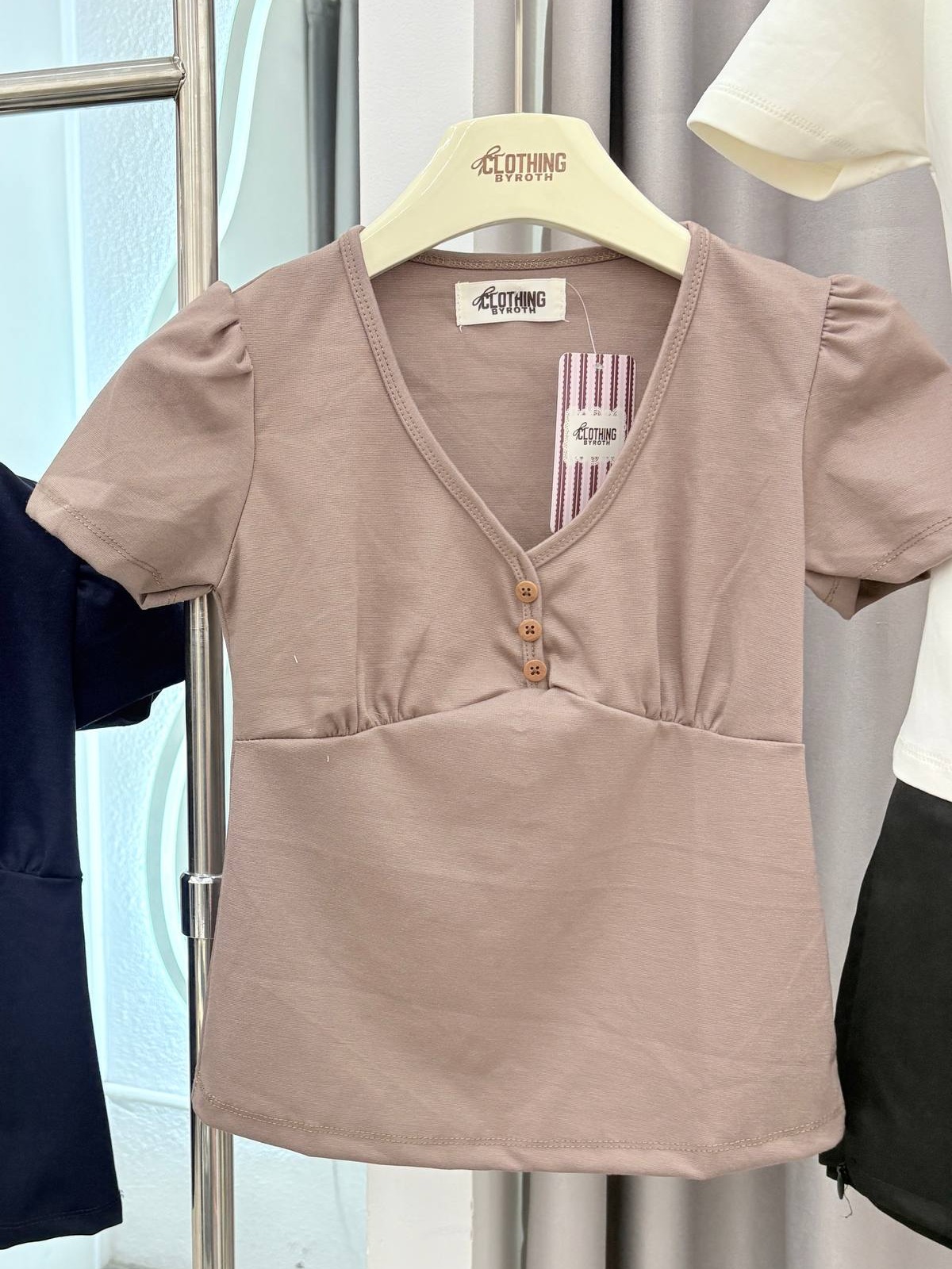 Puff-sleeve button-front empire waist top