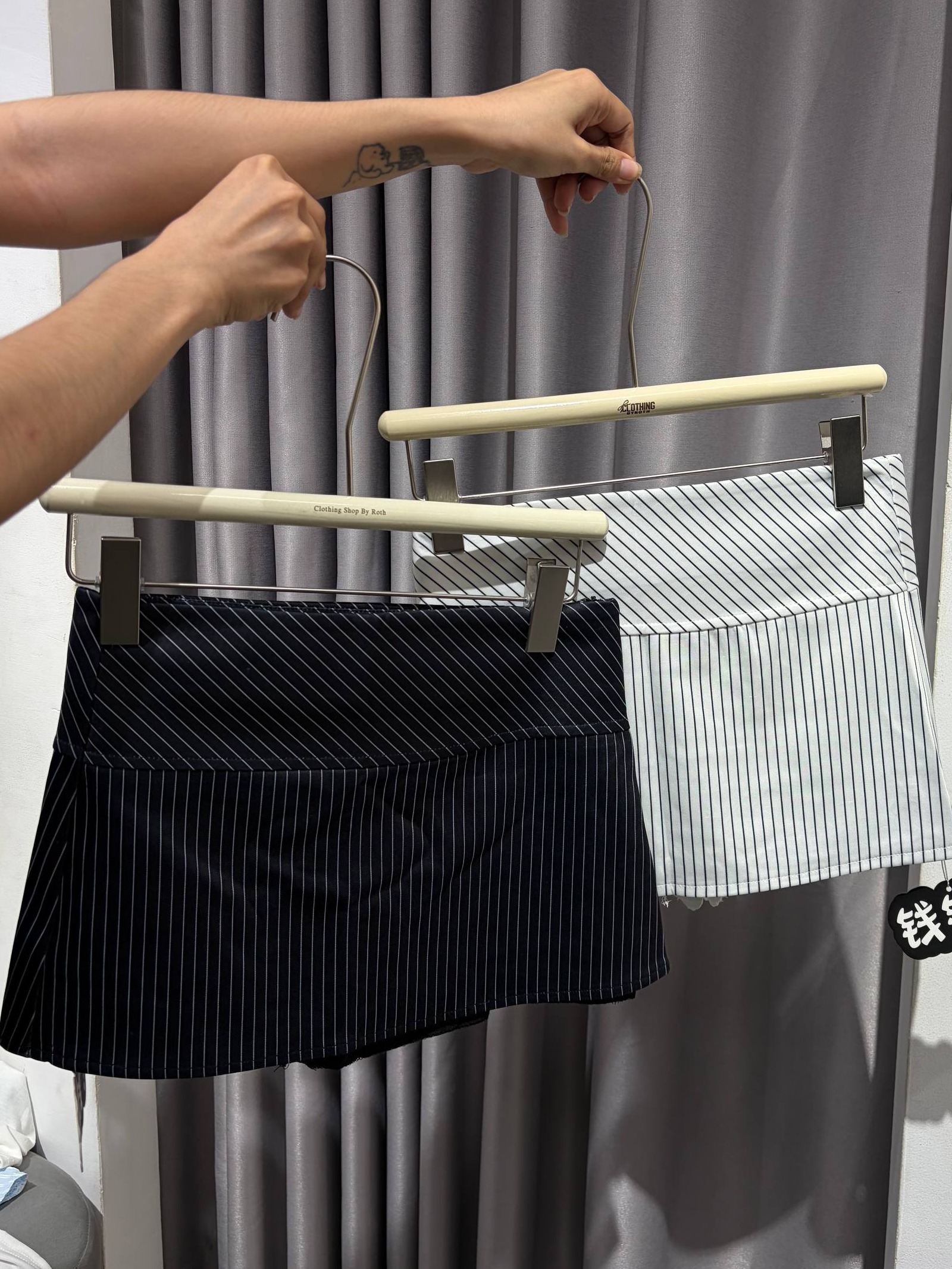 pinstripe pleated drop-waist mini skirt