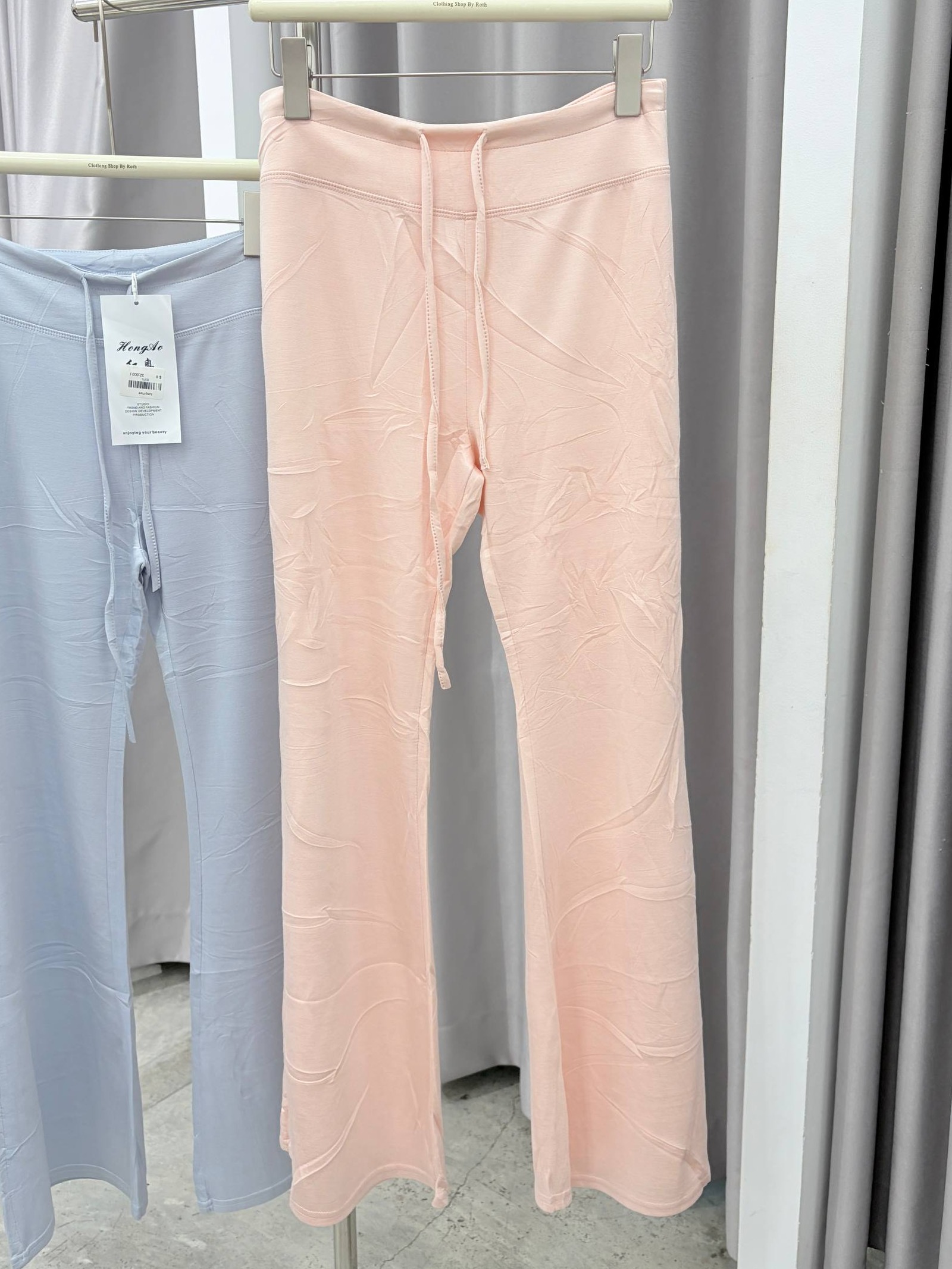 Low-rise lace-up flare pants