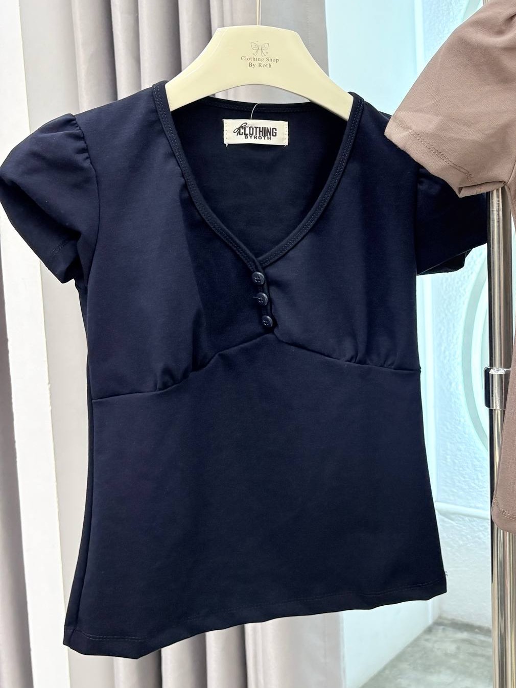 Puff-sleeve button-front empire waist top