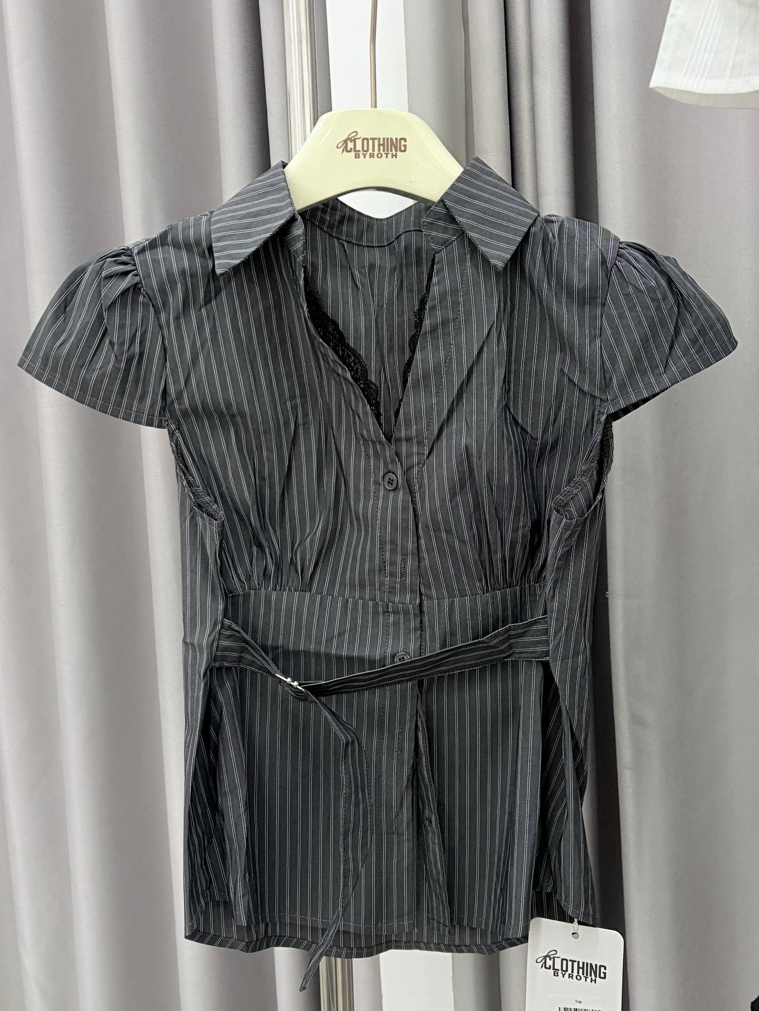 Belted cap-sleeve button-up blouse